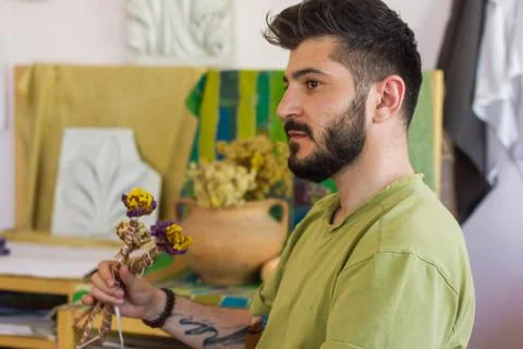 Young man sitting and looking Foto stock