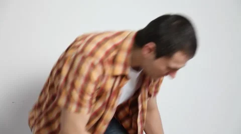 Young man sitting and using a pad Stock Footage 60064227
