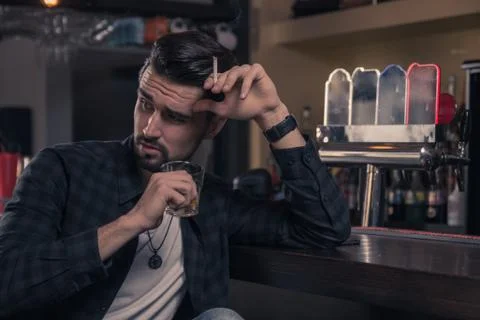 Young man sitting bar drinking Stock Photos