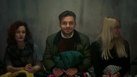 Young Man Sitting Between Two Young Women Talking. Man Is Very Confused. Stock Footage 149943329