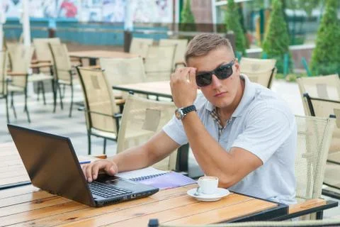 Young man sitting in cafe Stock Photos