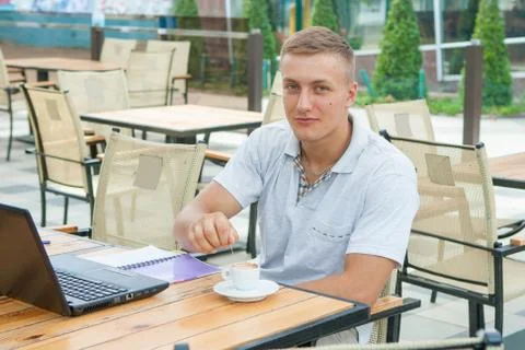 Young man sitting in cafe Stock Photos