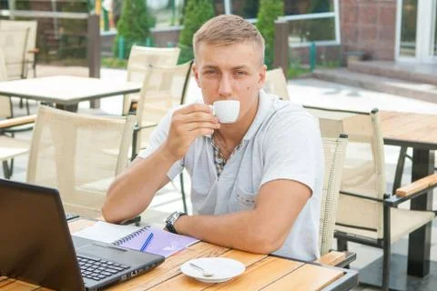 Young man sitting in cafe Stock Photos