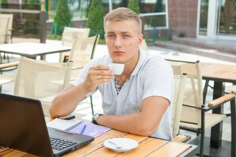 Young man sitting in cafe Stock Photos