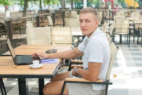 Young man sitting in cafe Stock Photos