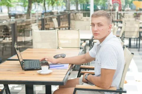 Young man sitting in cafe Stock Photos
