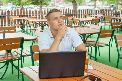 Young man sitting in cafe Stock Photos