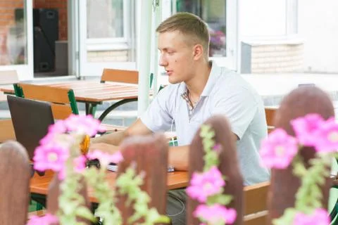 Young man sitting in cafe Stock Photos