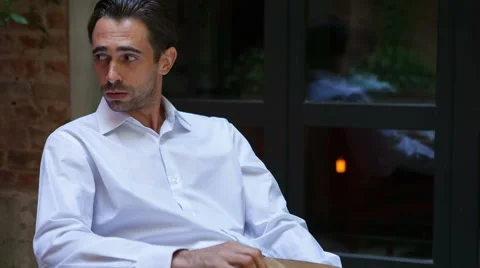 Young man sitting in cafe waiting for somebody Stock-Footage 42476809