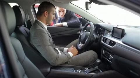 Young man sitting in car Stock Footage 55244169