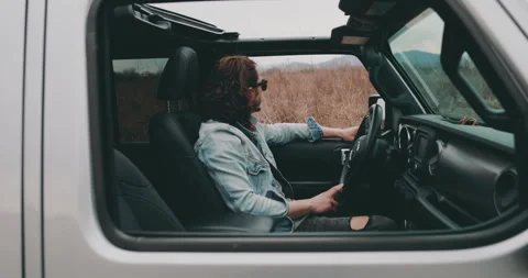A young man is sitting in a car Stock Footage 240702959