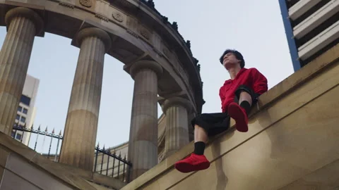 Young Man Sitting on the edge Stock Footage 264212205