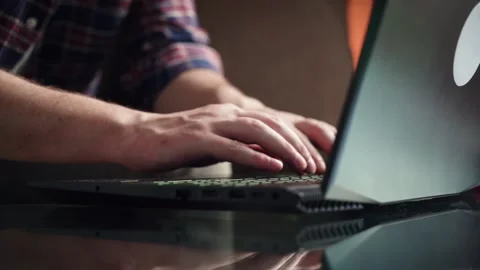 Young man sitting on sofa with laptop, working from home concept. Stock Footage 207779728