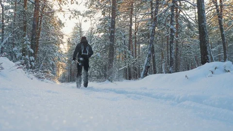 A young man is skiing in the winter forest. 스톡 동영상 121791247