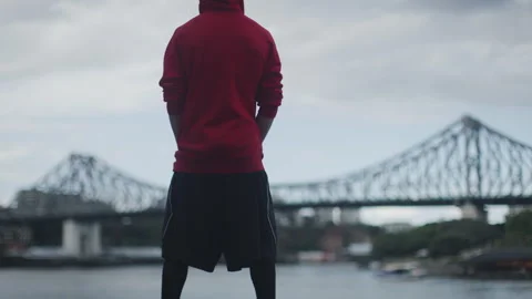 Young man with a skull mask looking into a bridge Stock Footage 264197601