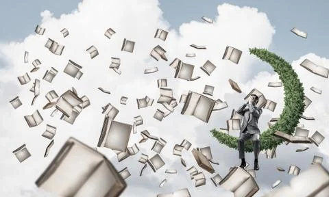 Young man in sky do not want to see anything and books flying ar Stock Photos