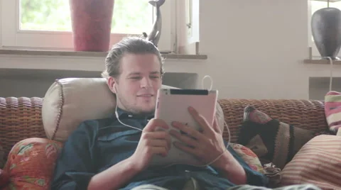 Young man skyping with girlfriend Stock Footage 40667586