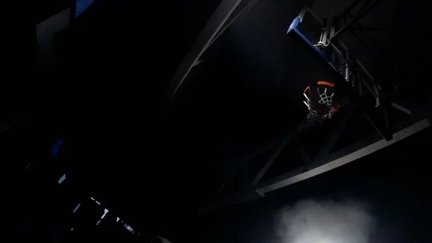 Young man slam dunks from trampoline in slow motion Video stock 123501904