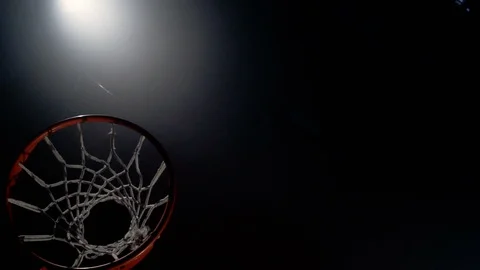 Young man slam dunks from trampoline in slow motion Stock Footage