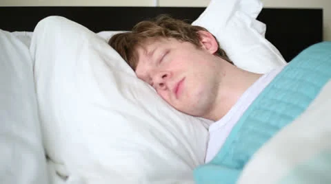 Young Man Sleeping in Bed - Close-up Stock Footage 25348112