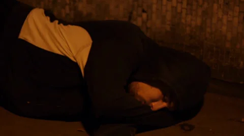 Young Man Sleeps Alone in Empty Underpass Video stock 39504159