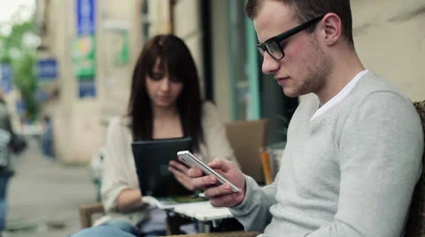 Young man with smartphone in the city, steadicam shot HD Stock Footage