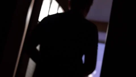 A Young Man With A Smartphone In His Hands Walks Through The Doorway Stock Footage 166226906