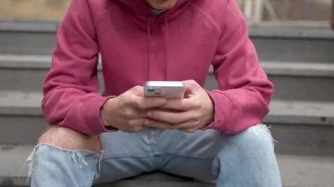 Young Man on Smartphone - From Screen to Face Reveal Stock Footage 257179924