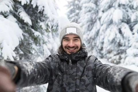 Young Man Smile Camera Taking Selfie Photo In Winter Snow Forest Guy Outdoors Stock Photos