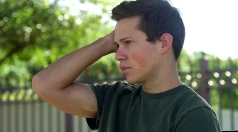 Young man smiles after checking phone, CLOSE, 4K Stock Footage 48703102