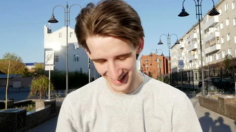 Young man smiles Stock Footage 64743096