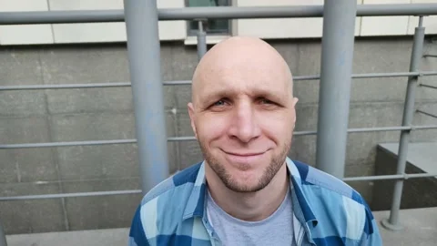 Young man smiles looking at camera Stock Footage 201891868