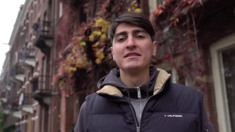 Young man smiling and looking at camera. Portrait of a happy handsome young man Stockbeeldmateriaal 70059679