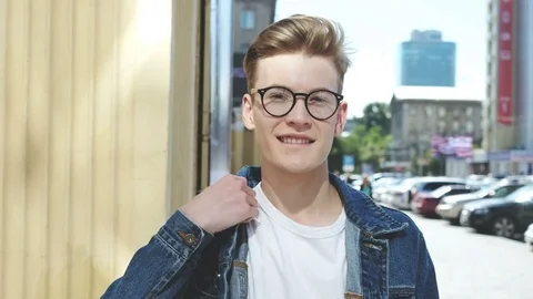 Young man smiling and looking at camera. Stock Footage 81137741