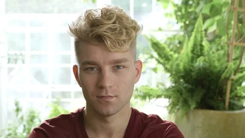 Young man smiling and looking at camera. 動画素材 88018053