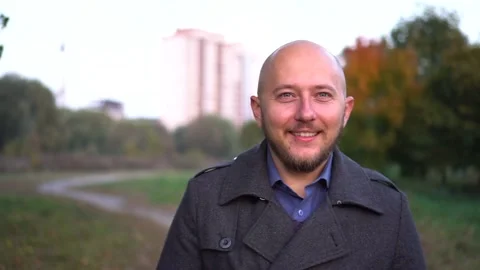 Young man smiling and looking at camera. Portrait of a happy handsome young man Stock Footage 97116477