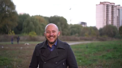 Young man smiling and looking at camera. Portrait of a happy handsome young man Stock Footage 97117153