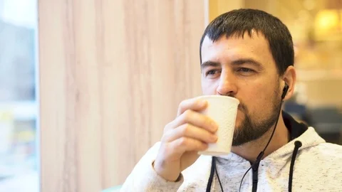 Young man smiling to camera in the cafe. Stock Footage 83679986