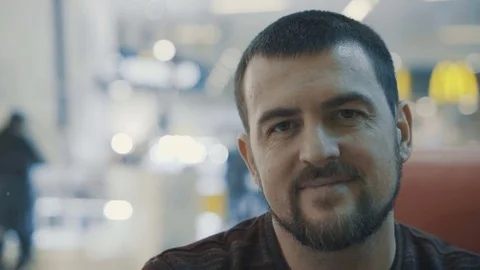 Young man smiling to camera in the cafe. Stock Footage 84150446