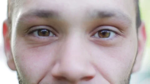 Young Man Smiling at Camera, Eye Detail Stockbeeldmateriaal 76268032