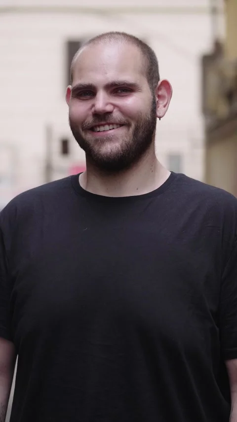 Young man smiling at camera Stock Footage 303505188