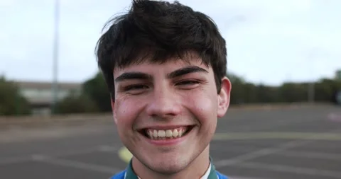 Young man smiling on camera outdoor Stock Footage 185512822