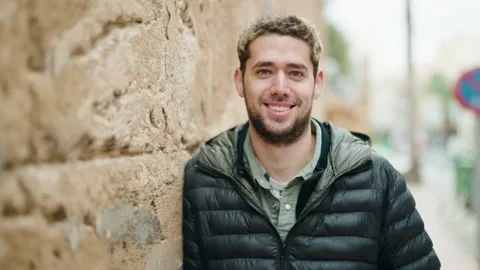 Young man smiling confident standing at street Stock Footage 171382581