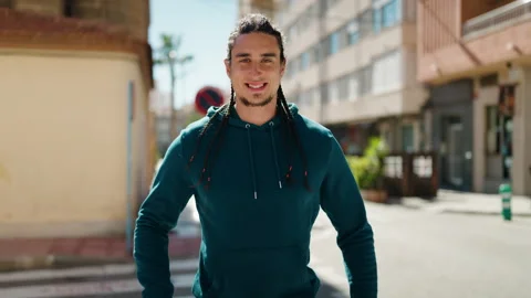 Young man smiling confident standing with arms crossed gesture at street Stock Footage 171393124