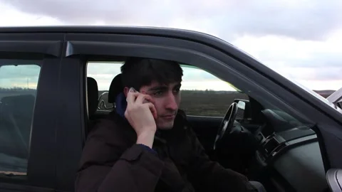 Young man is smiling speaking by the phone Stock Footage 123725112