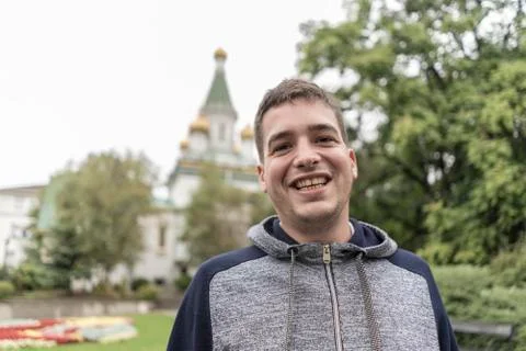 Young man smiling in the streets of Sofia . Stock Photos