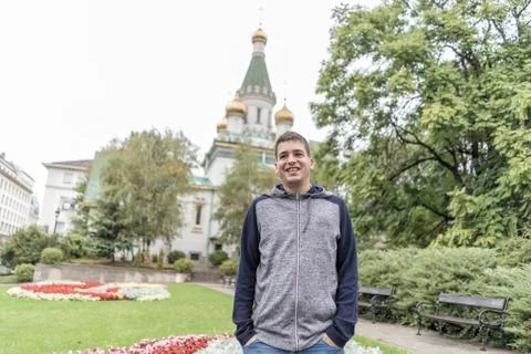 Young man smiling in the streets of Sofia . Stock Photos
