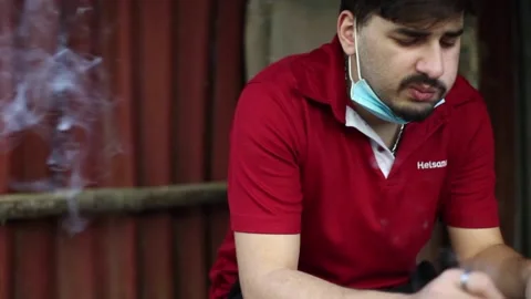 Young man smoke a joint Stock-Footage 145101286