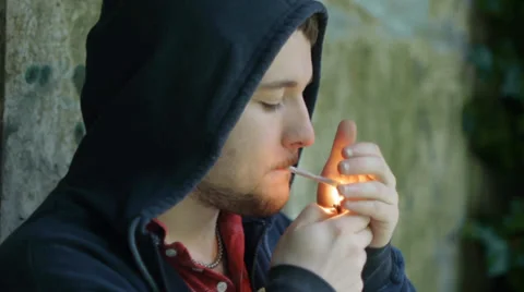 Young Man Smokes Alone in Depression Stock Footage 39504211