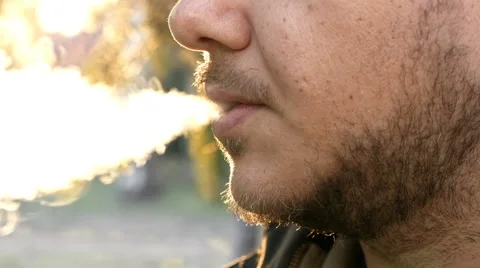  young man smokes a cigarette Stock Footage 63420209